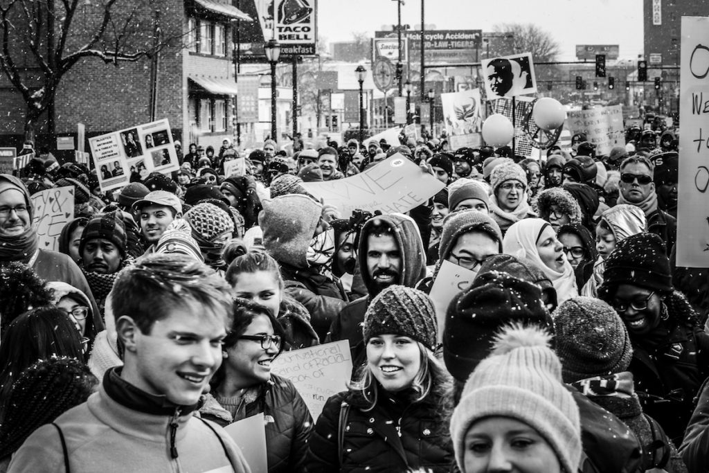 Black and white photo from the MLK Parade, with snow falling