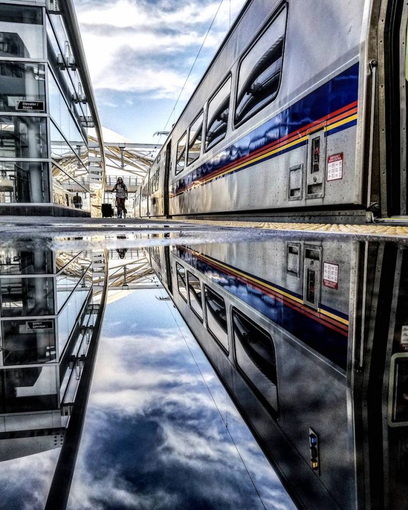 RTD A Line at Union Station with puddle reflection