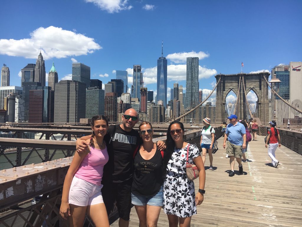 Jose M. and family from Madrid, Spain along with Greeter Diane couldn't pass up a photo op on the Brooklyn Bridge (New York City)